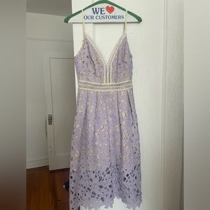 Purple lace inspired midi dress with cream lining. Size small.